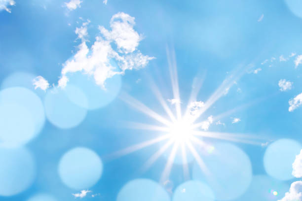 istock Bright sun with beautiful beams and bokeh light in the sky 1475237731