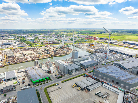 Industrial area in Kampen seen from above with the port connected to the river IJssel  during a springtime day in Overijssel, Netherlands.