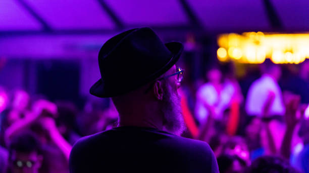 istock close-up of a deejay behind while playing in the disco 1475241758