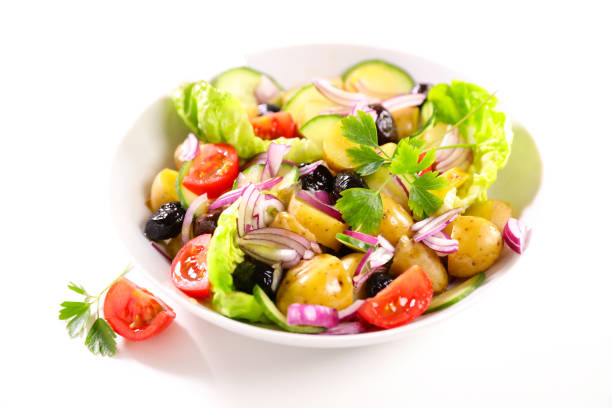 mixed vegetable salad with potato, tomato, olive and onion
