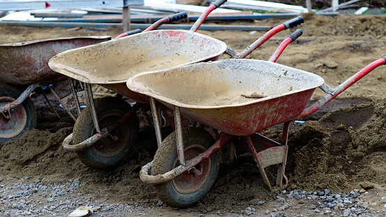 wheelbarrow dirty with dust and clay