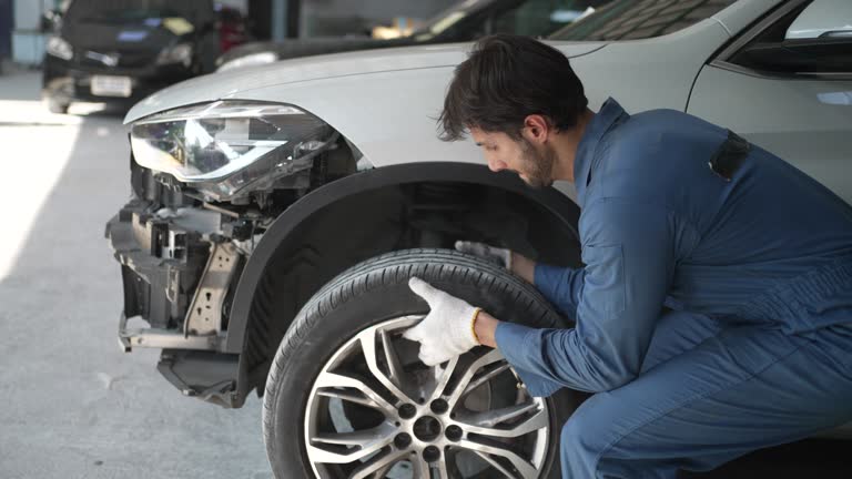 Young entrepreneur work at car garage.