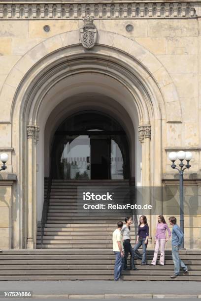 Group Of Students In Discussion Standing On Staircase Stock Photo - Download Image Now