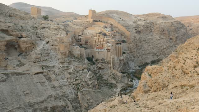 A desert monastery above the wadi. 4K