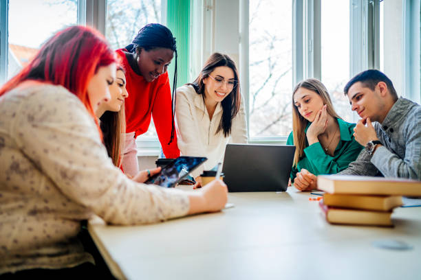 istock Group of students preparing exams together 1475251863
