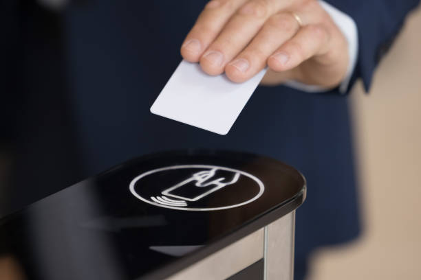 istock Unknown businessman in formal suit uses pass card passing checkpoint 1475257203