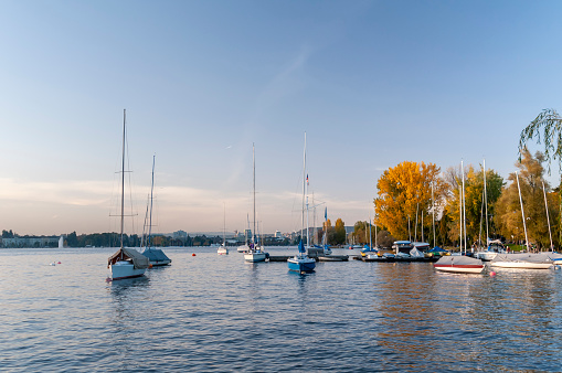 Zurich, Switzerland on October 20, 2012. Boats moored on Lake Zurich in the late afternoon.