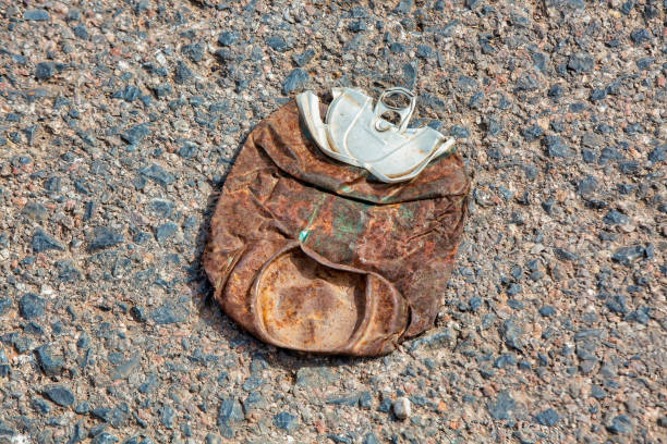 rusty soda can, rusty soda can lying in the field, rusty can, old rusty can outdoor,trash