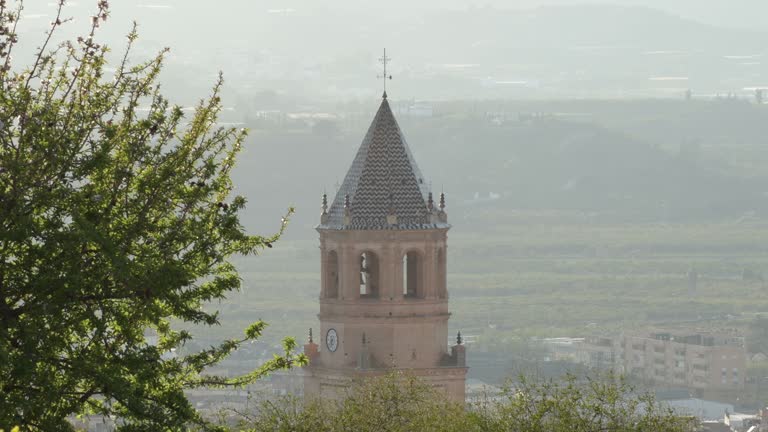 San Juan church bell tower at sunset , Velez Malaga, Spain