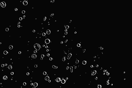 Abstraction with air bubbles in ice on a black background