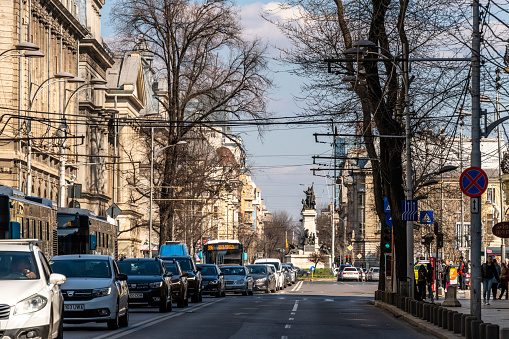Bucharest, Romania. March 13, 2023: Downtown Bucharest with people on the streets and mixed use buildings.