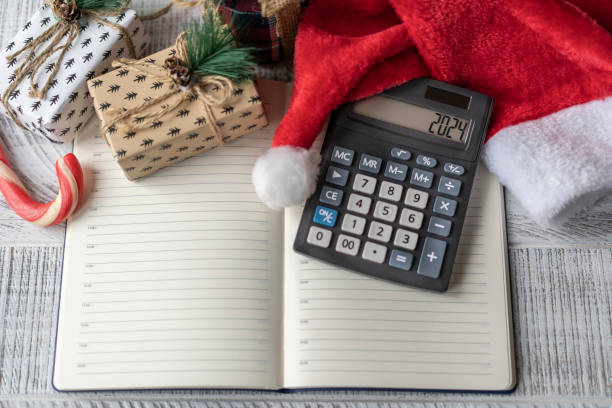 istock New Year's layout with calculator, Santa's hat and Christmas decorations 1475266840