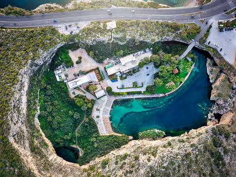 Aerial top down view of the popular Vouliagmeni lake in south Athens, Greece