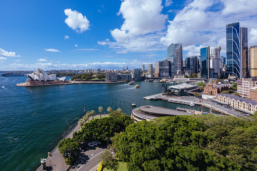 SYDNEY, AUSTRALIA - MARCH 4 2023: The Sydney CBD and surrounding harbour, including Circular Quay and The Rocks on a clear autumn day in Sydney, Australia