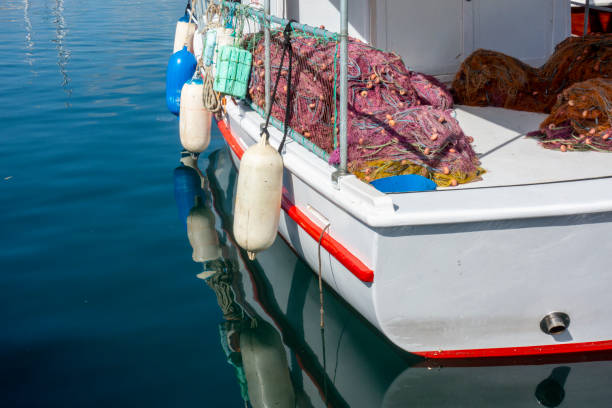 Reflection of fisherman boat in Bodrum harbor