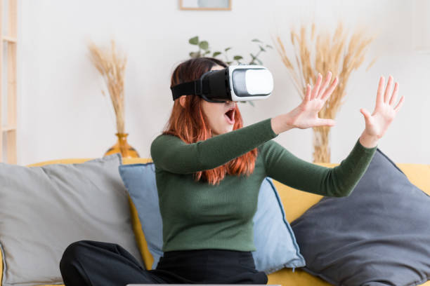 istock Young woman in VR goggles 1475270292