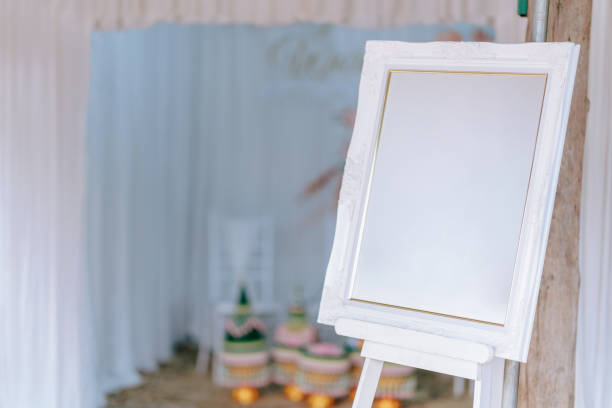 istock A picture frame or signboard with a blank white space is set up for wedding decorations. Clipping path. 1475272321