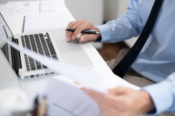 istock Business man working by using laptop computer Hands typing on a keyboard. Professional investor working new start up project. business planning in office. Technology business 1475272556