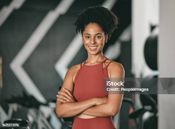 Black Woman Fitness And Coach With Arms Crossed And Smile For Training Exercise Or Workout At The Gym Portrait Of A Confident African American Female Sports Instructor With Vision For Healthy Body Stock Photo - Download Image Now