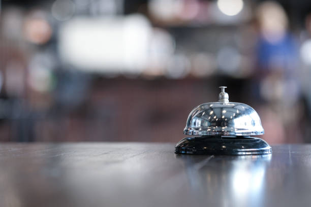 istock Hotel reception counter desk with service bell. 1475274562