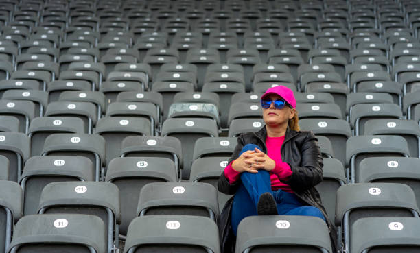 istock Woman Sitting On Seat At Stadium 1475274612