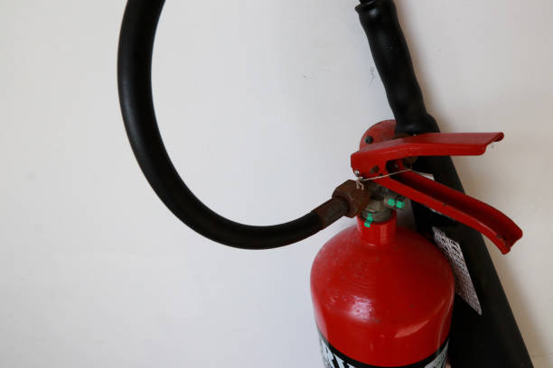 istock A fire extinguisher is an active fire protection device used to extinguish or control small fires 1475275260