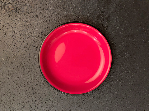 Red bowl on black background