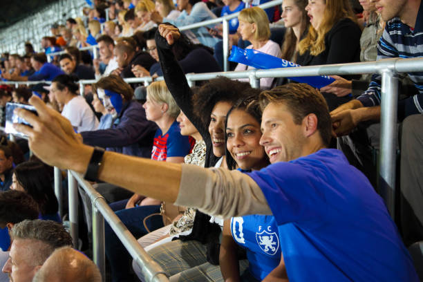 istock Young people at footbal match making a selfie 1475278136