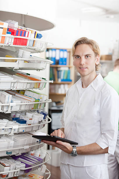 istock Portrait Of Male Pharmacist Holding Tablet Pc 147527863
