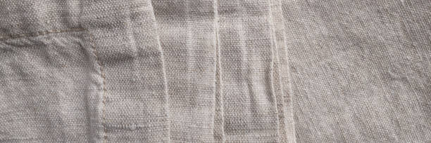 istock Natural linen fabric texture, flaxen textile background banner, header 1475279009