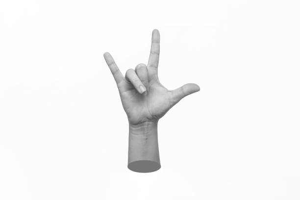 istock Female hand showing three fingers signifying the rock gesture on white background 1475281753