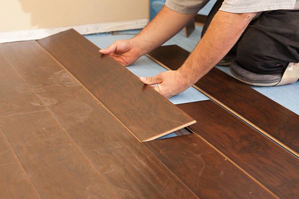 istock Man Installing New Laminate Wood Flooring 147528206
