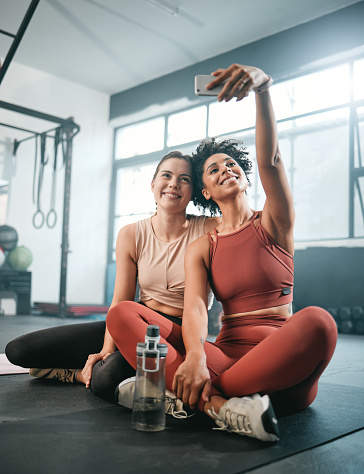 Friends, selfie and fitness with women in gym for workout, social media and wellness blog. Exercise, training and health with girl athlete and phone for online post, internet and sports picture