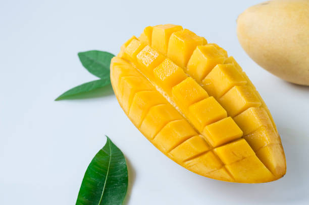 istock Ripe mango fruit with juicy yellow flesh. 1475283576