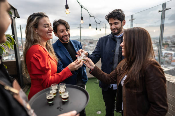 istock Coworkers making a celebratory toast in the rooftop restaurant 1475285458