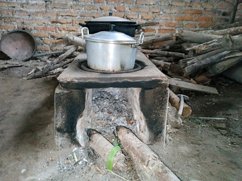 Traditional Wood Stove With Die Out Wood Pile In It