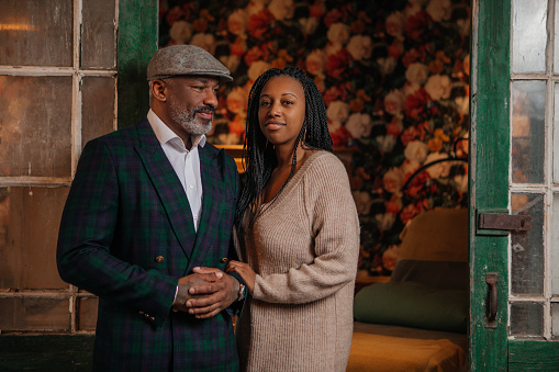 Lifestyle portrait of beautiful black couple indoors