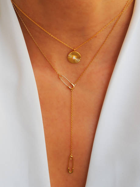 istock Necklaces accumulation on a white jacket 1475289061