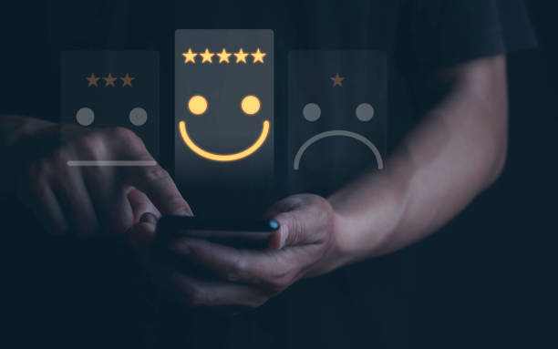 istock Customer service and satisfaction concept for Businessman using smartphone for choose smiley face icon for client evaluation and customer satisfaction after use product and service concept. 1475289237