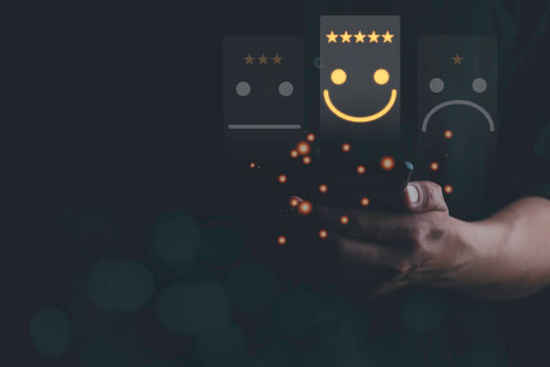 istock Businessman using smartphone for choose smiley face icon for client evaluation and customer satisfaction after use product and service concept. Customer service and satisfaction concept. Copy Space. 1475289240