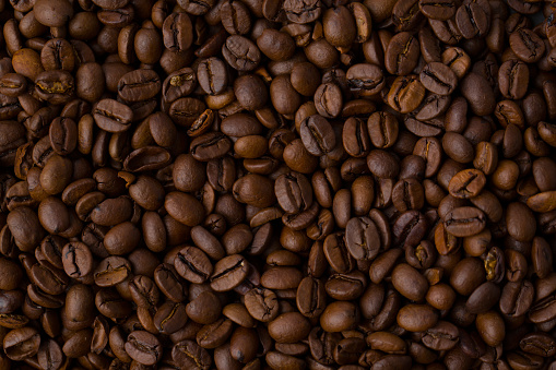 Roasted coffee beans background abstract top view