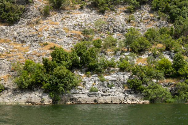 istock Landscape with lake and green mountains. 1475294332
