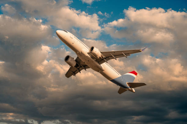 istock passenger airplane departing at sunset 1475294366
