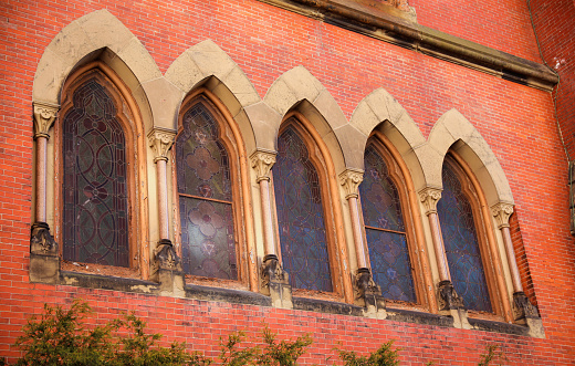 The actual title of this window is The Risen Christ.  It was purchased in 1909 from Tiffany Studios in New York.  It depicts Christ with open arms inviting the world to himself.  Produced before 1923, it is in public domain. 