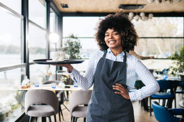 istock Portrait of a young waitress 1475298464