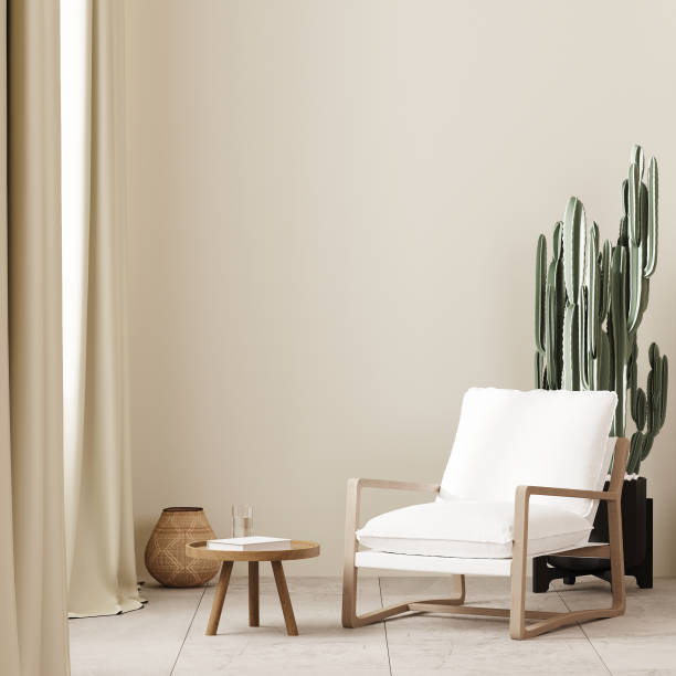 White armchair with coffee table near window in boho style interior background with beige wall, , empty wall mock up, 3d render