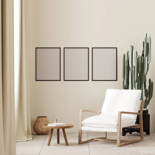 istock Three poster frames mock up in boho style interior background with white armchair and coffee table near window ,beige wall, 3d render 1475298955