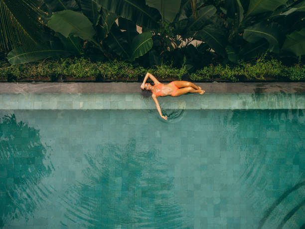 Beautiful woman lying at the poolside