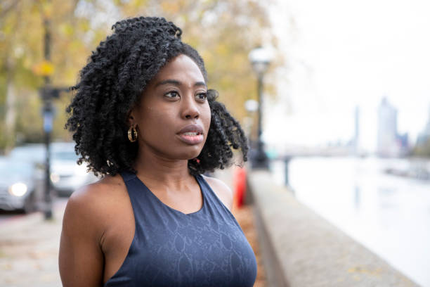 istock Female keep-fit enthusiast looking over the River Thames 1475301212