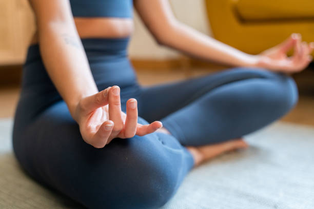 istock Woman doing yoga on floor 1475303029